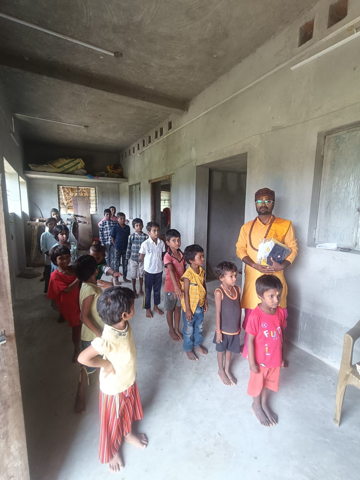Donating clothes to a student of Gurukul Aryavart.
